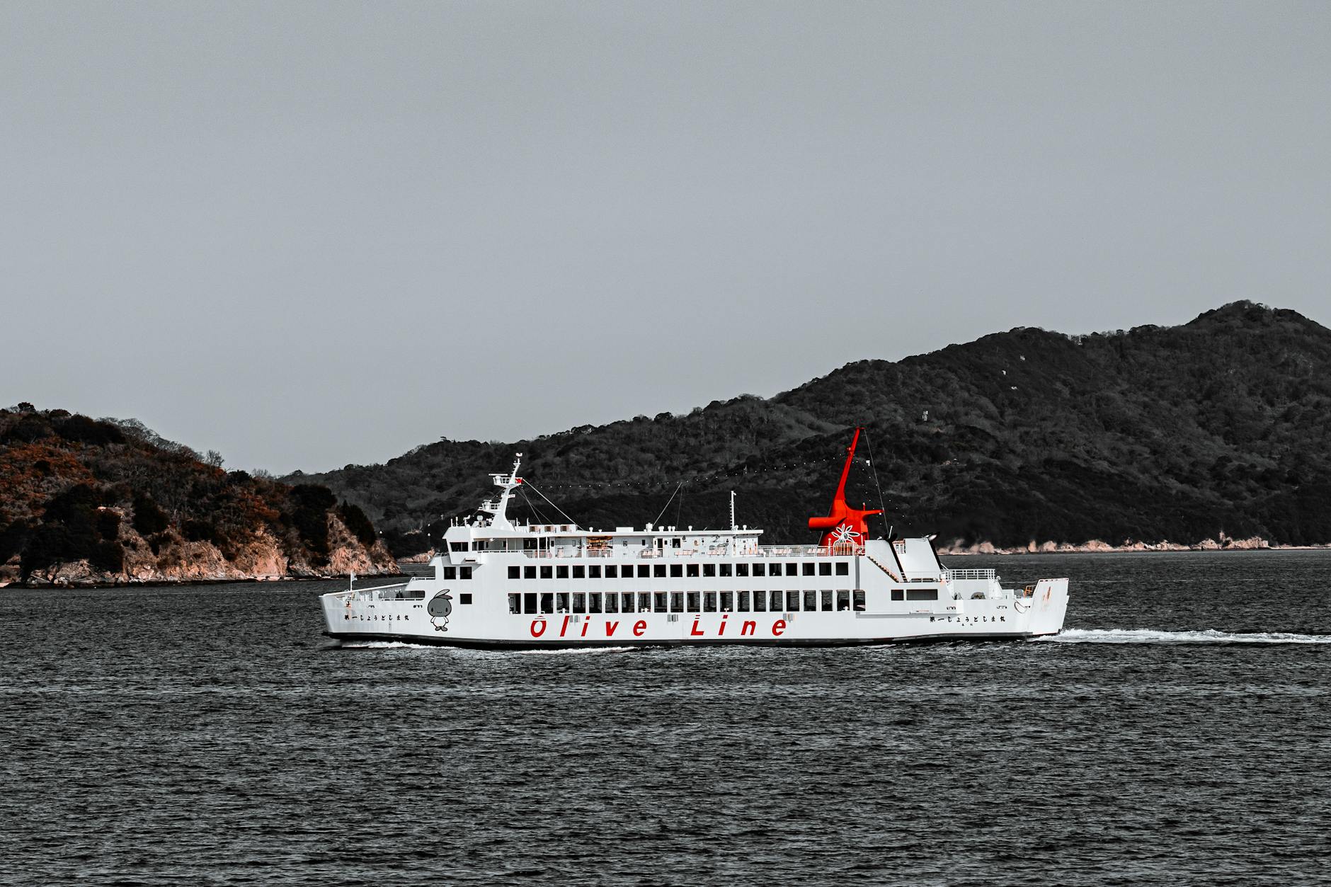 Olive Line ferry cruising near Shodoshima island in Seto Inland Sea, Japan.