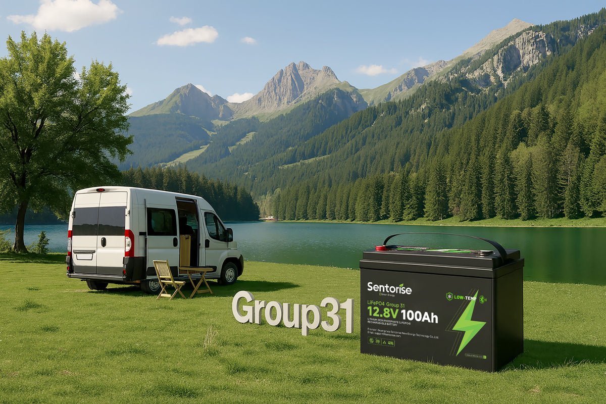 Sentorise 12.8V 100Ah Group 31 battery beside a camper van at an alpine lake